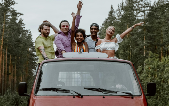 student travelling in a camper van through a forest