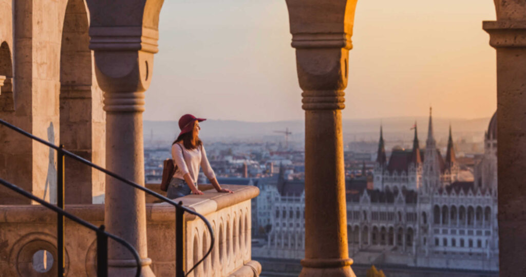 student looking out across a European city on study abroad